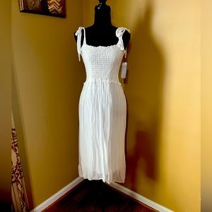 Beautiful summer smock dress with shoulder ties.  Perfect for summer outing!